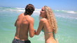 Couple going into the ocean