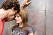 Young couple looking at each other, side view
