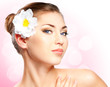 Closeup beautiful woman face with flower