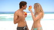 Couple cheering with cocktail