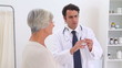 Doctor going to give an injection to a patient