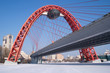 View of red arc bridge on frozen Moskva-river and many buildings View of red arc bridge on frozen Moskva-river and many buildings