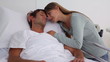 Woman embracing her unconscious husband