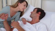 Woman talking to her sick husband 