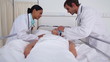 Doctor putting an oxygen mask to a patient