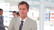 Video: Business man smiling as the camera moves Business man smiling as the camera moves