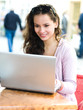 Young woman with notebook in cafe
