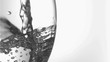 Water in super slow motion filling a glass