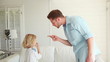 Father giving out to his son