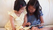 Video: Two children using a tablet computer together Two children using a tablet computer together