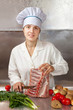 Cook woman cooking meat Cook woman cooking meat