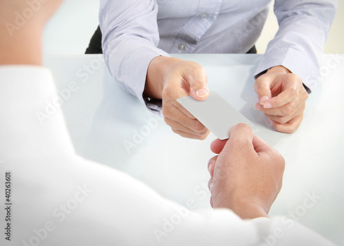 Photo: business people changing business cards business people changing business cards