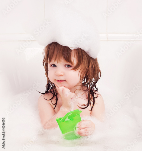 Foto: baby taking a bath baby taking a bath