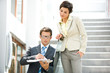 Business people looking at document