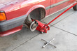 Automotive, car on jack without wheel Automotive, car on jack without wheel