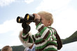 Boy using binoculars