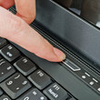 Female turning on a laptop