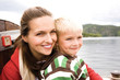 Mother with son, smiling, side view