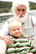 Grandfather sitting with grandson, portrait