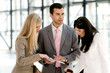 Young man and woman looking at brochure