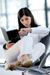 Young woman looking at wristwatch