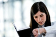 Young woman looking at wristwatch
