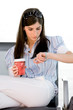 Young woman looking at wristwatch