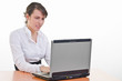 girl works on laptop