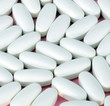 white pill on pink background
