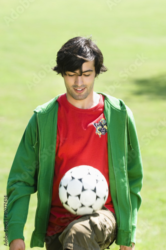 Photo: Young man playing Keepy Uppy Young man playing Keepy Uppy