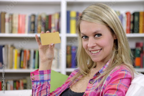 Photo: young woman with credit card smiling young woman with credit card smiling