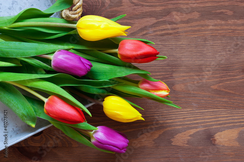 Photo: Tulips on a rustic background Tulips on a rustic background