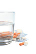 Tablets and a glass of water