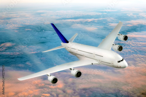 Photo: Modern airplane in the sky near Airport. Modern airplane in the sky near Airport.