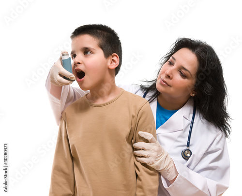 Photo: Doctor applying oxygen treatment on a little boy with asthma. Doctor applying oxygen treatment on a little boy with asthma.