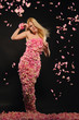 beautiful woman in dress of rose petals