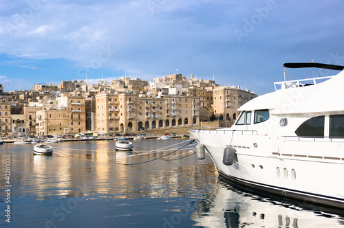 luxury sailboat moored in Senglea Marina, on background  Valletta - Malta