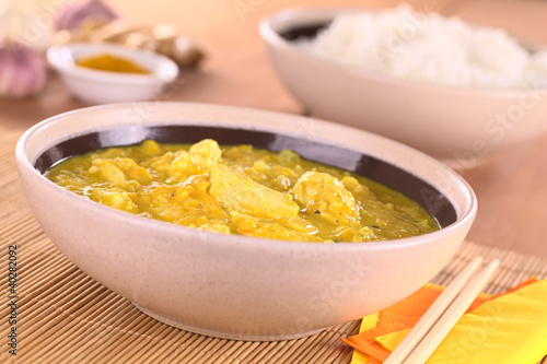 Photo: Chicken-mango curry with rice in the back Chicken-mango curry with rice in the back