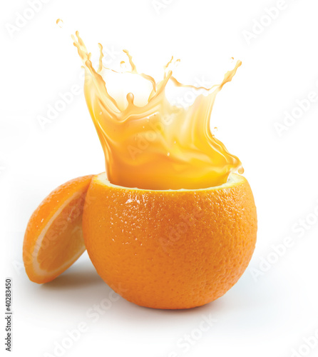 Photo: Orange juice splashing isolated on white Orange juice splashing isolated on white