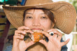 Young woman tasted fried chicken..