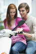 Young couples sitting on motor scooter