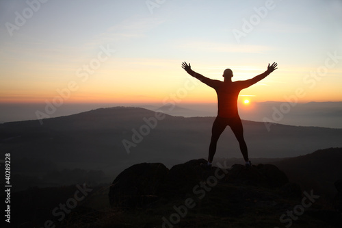 Photo: Man on the mountain peak Man on the mountain peak
