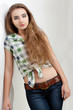 young woman wearing country style clothes looking at camera