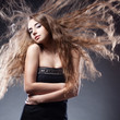 woman with flying hair posing