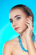 woman portrait with necklace and ring on finger woman portrait with necklace and ring on finger