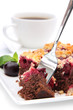 Cherry cake with cup of coffee