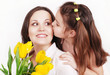 Daughter kissing mother
