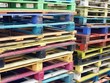 Piles of colorful wooden pallets Piles of colorful wooden pallets