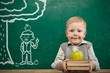 Cheerful smiling  child with a book . School concept