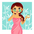 beautiful young girl applying facial mask